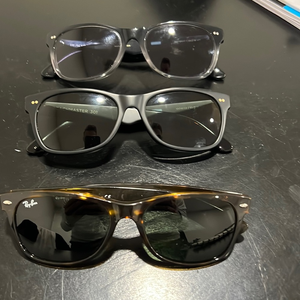 One ray ban new wayfarer and two Toms sunglasses